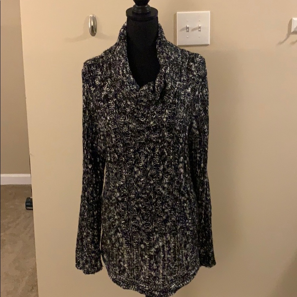 Black and white turtleneck sweater.